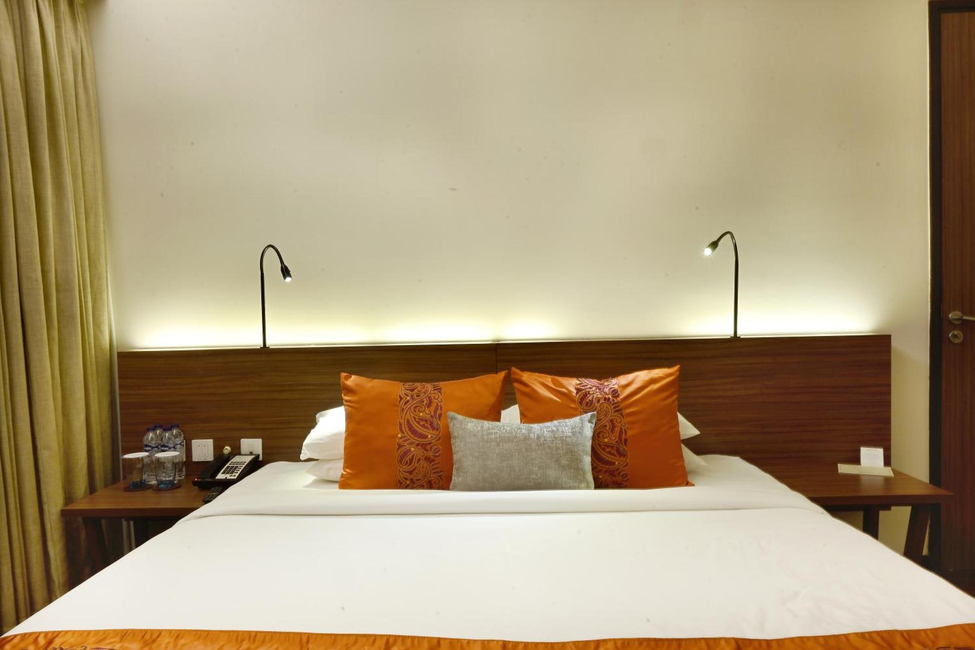 Vivanta Kolkata Em Bypass المظهر الخارجي الصورة A bed in a hotel room